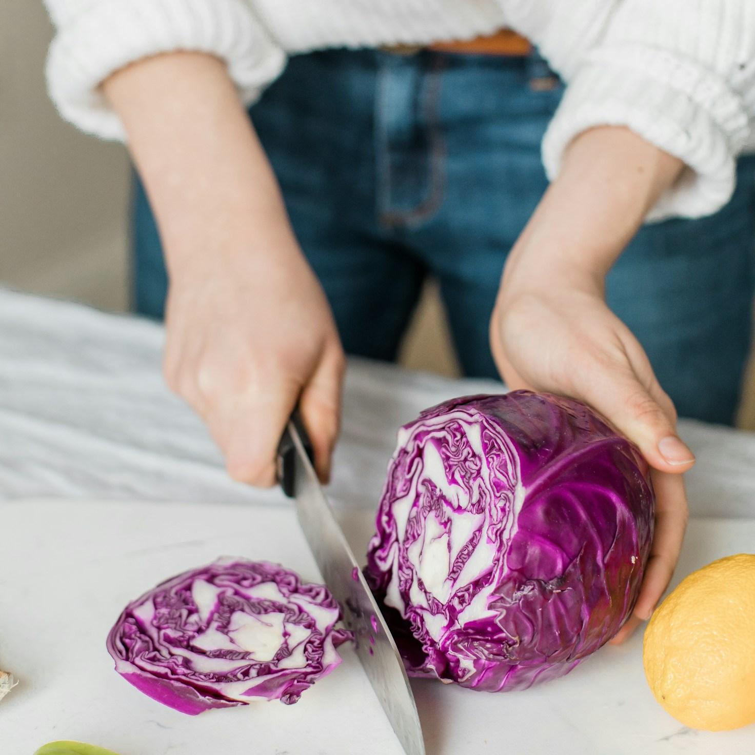 Community members collaborating in a modern kitchen space, sharing recipes and cooking techniques